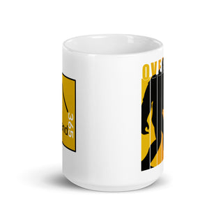 Bigfoot walking towards the trees in the sunset. 15 oz coffee mug. side view. overland365.com