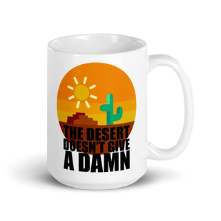 THE DESERT DOESNT GIVE A DAMN. White 15 oz coffee mug. Front. Overland365.com