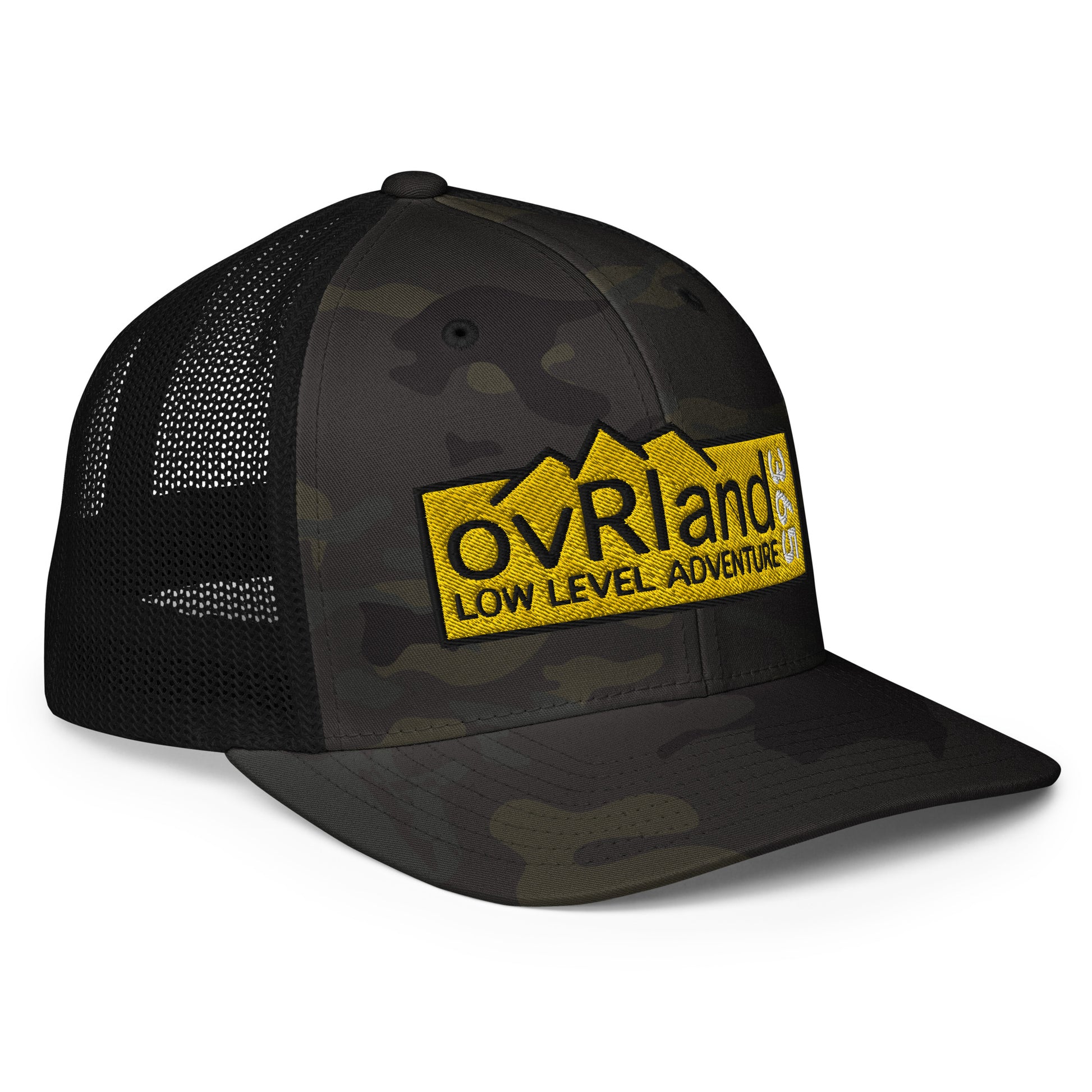 Black MultiCam FlexFit Trucker Cap with our Low Level Adventure yellow logo. side facing. overland365.com