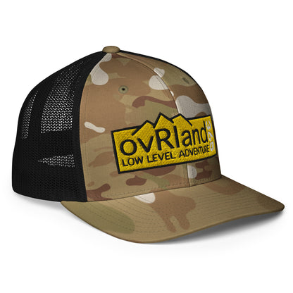 Green MultiCam FlexFit Trucker Cap with our Low Level Adventure yellow logo. side facing. overland365.com